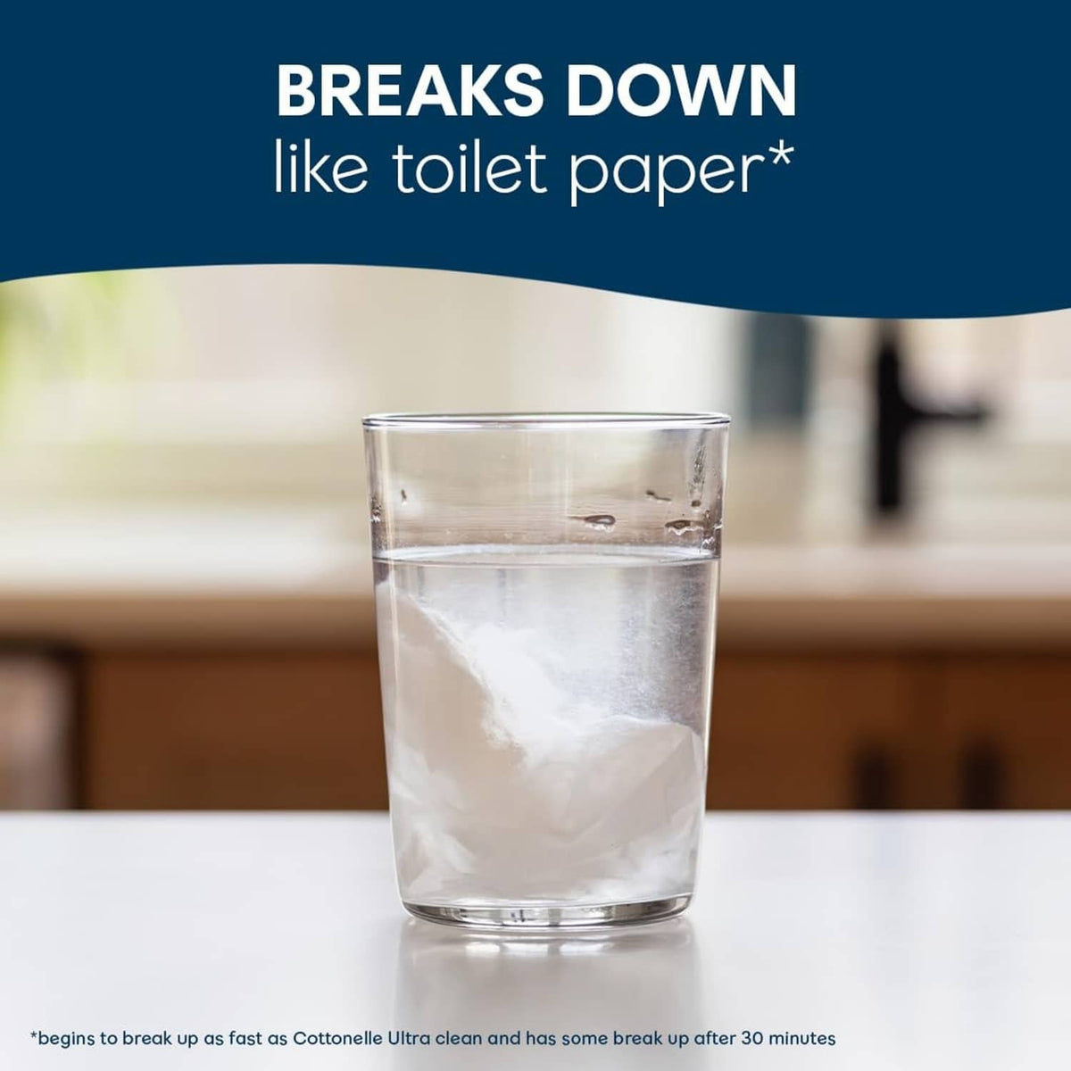 Cottonelle flushable wet wipes dissolving concept with a glass of water