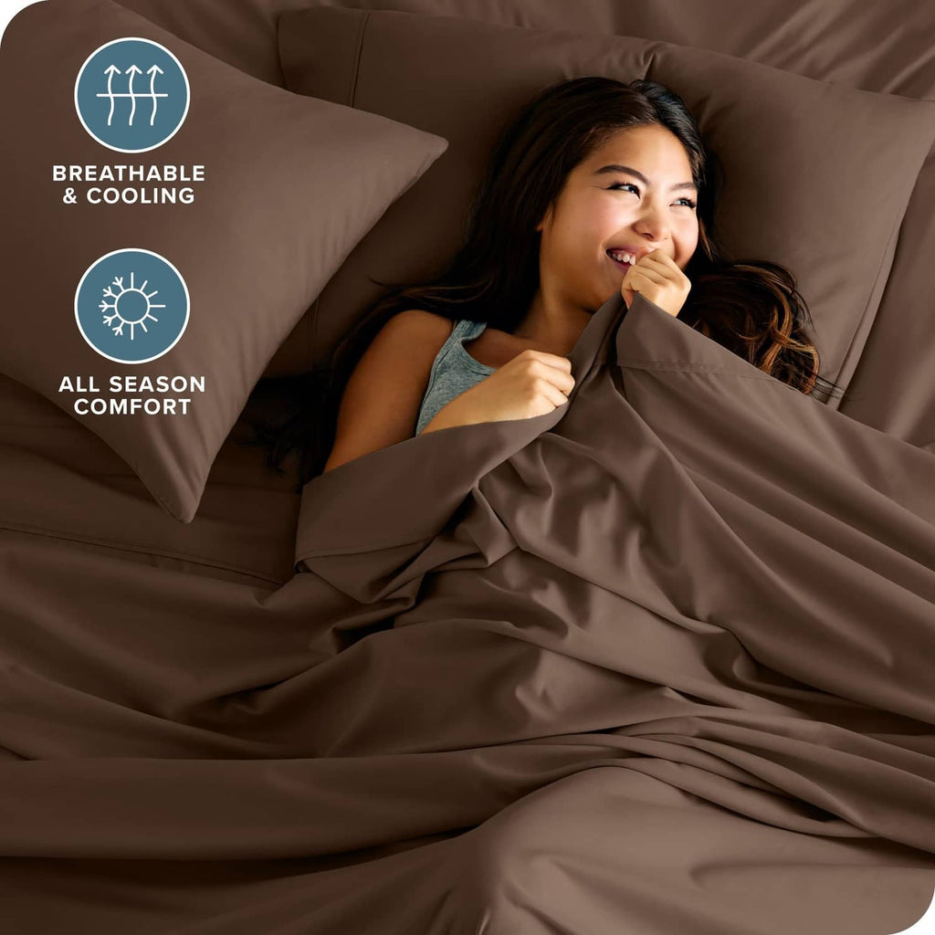 Cocoa brown sheet set with pillow and soft fabric drape over the mattress