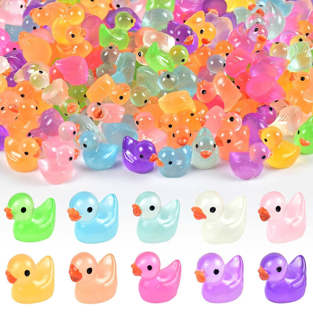 Assorted tiny luminous resin duck figurines in multiple bright colors