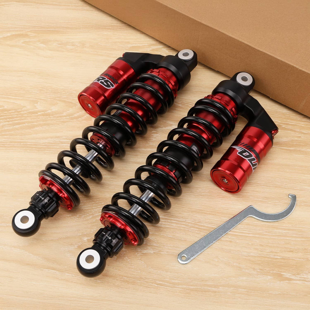 Pair of red and black front suspension shocks with coil springs and mounting eyelets