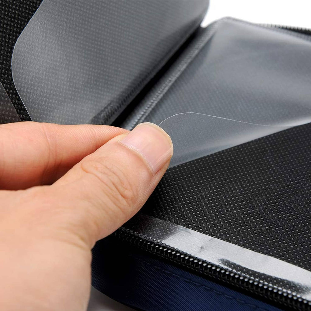 Hand pulling a disc from a black CD/DVD case sleeve with zipper trim