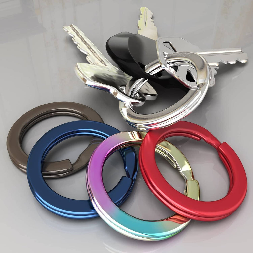Assorted colored metal key rings with keys, including red, blue, and purple