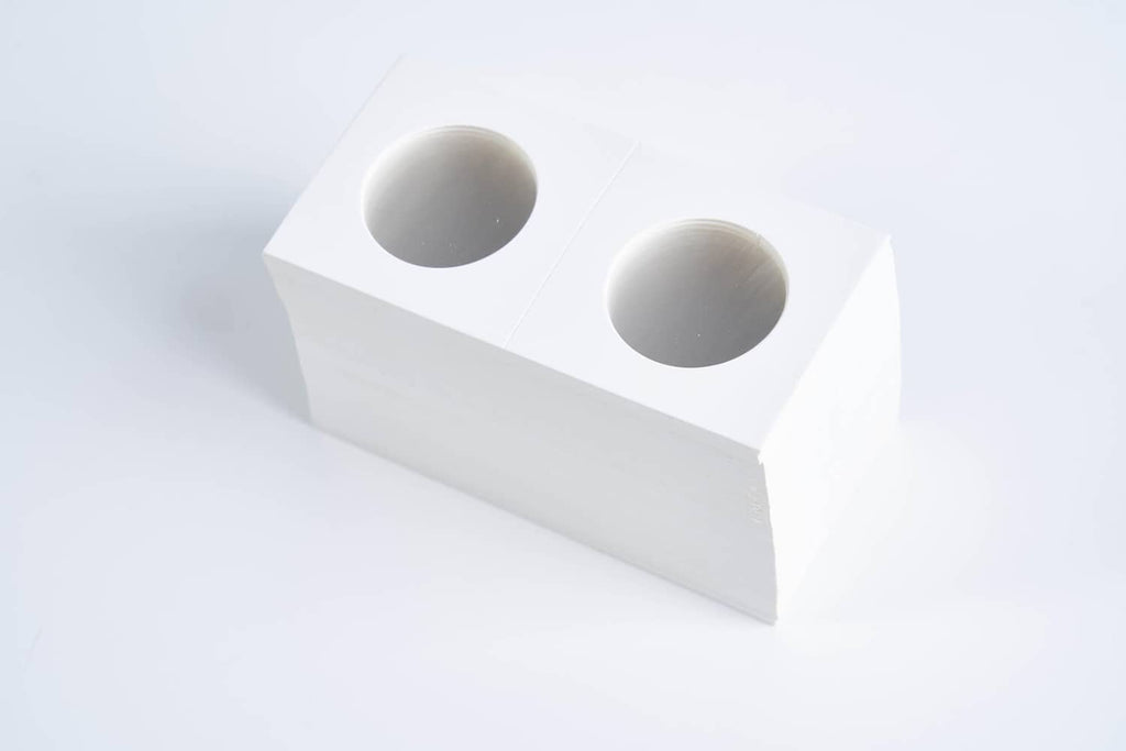 White cardboard coin holder with two oval openings