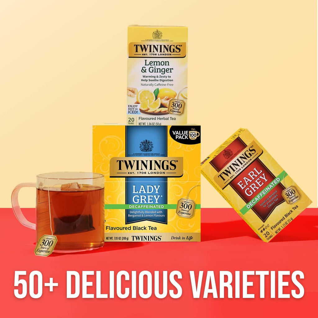 Twinings tea assortment with Lady Grey decaffeinated boxes and tea bags around cups