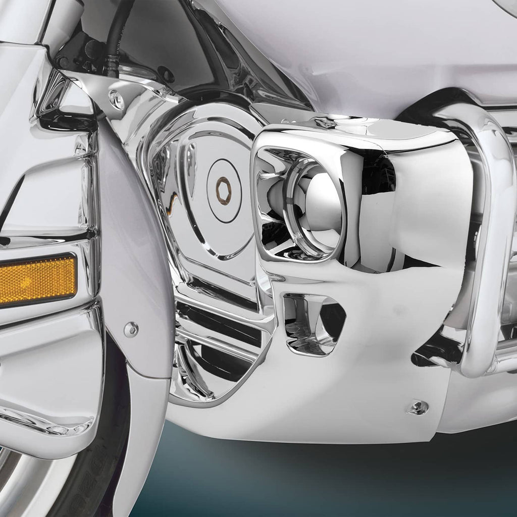 Chrome engine front cowl cover close-up, glossy surfaces and round opening