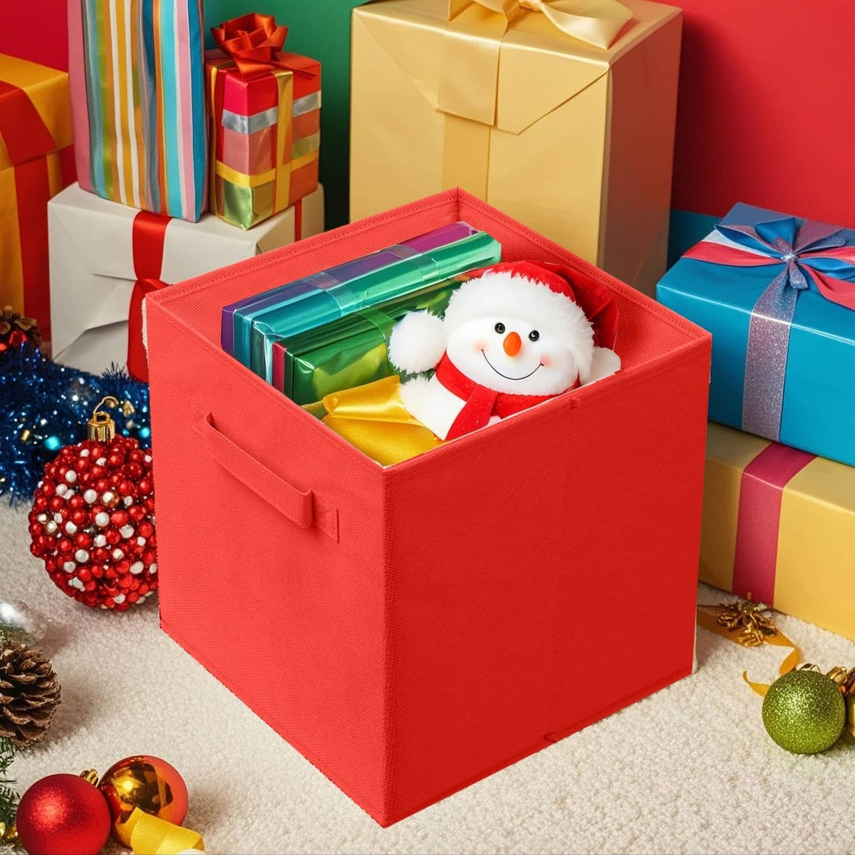 Red foldable fabric storage cube bin holding a snowman and wrapped gifts