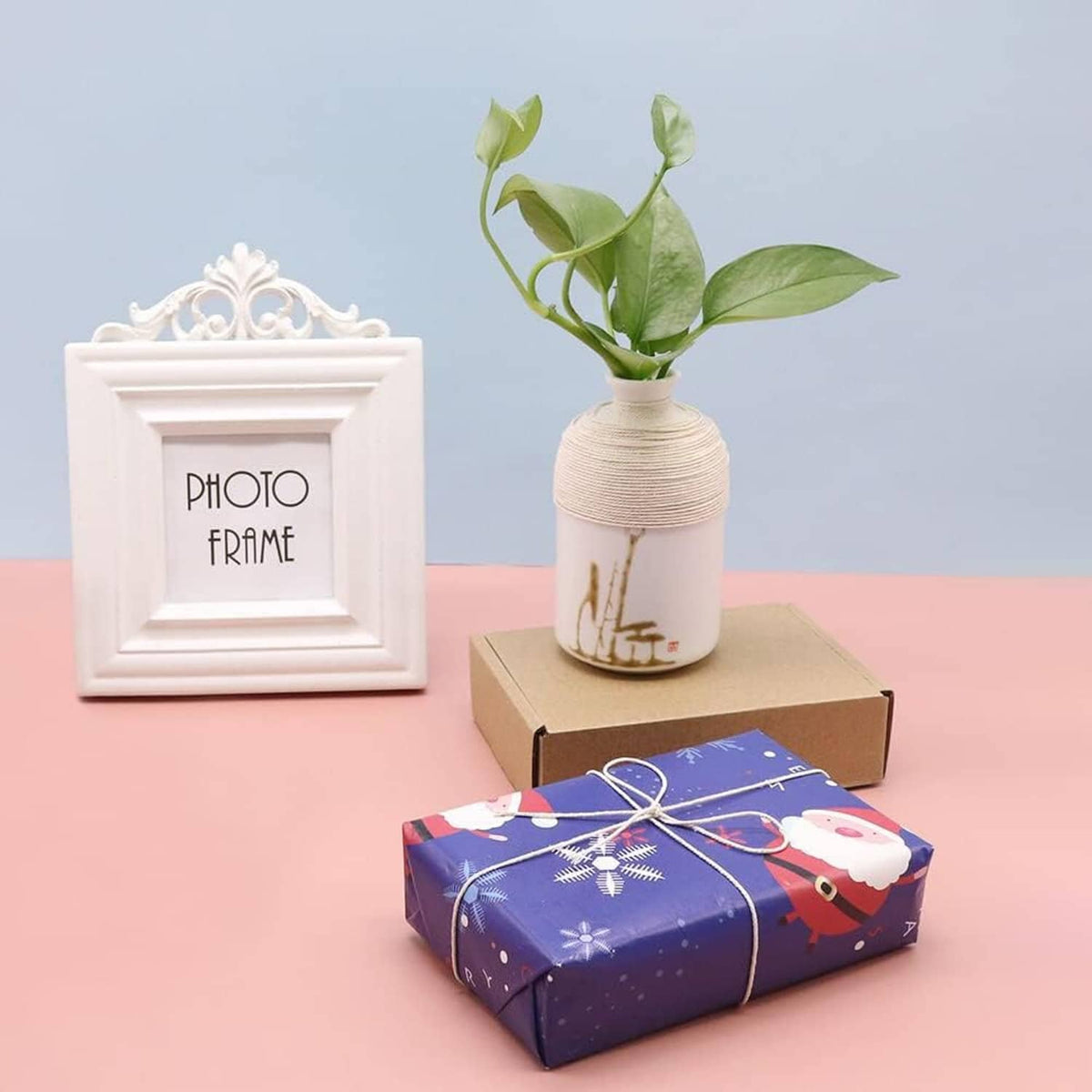 White cotton twine spool with bundled string on a gift-wrapped set