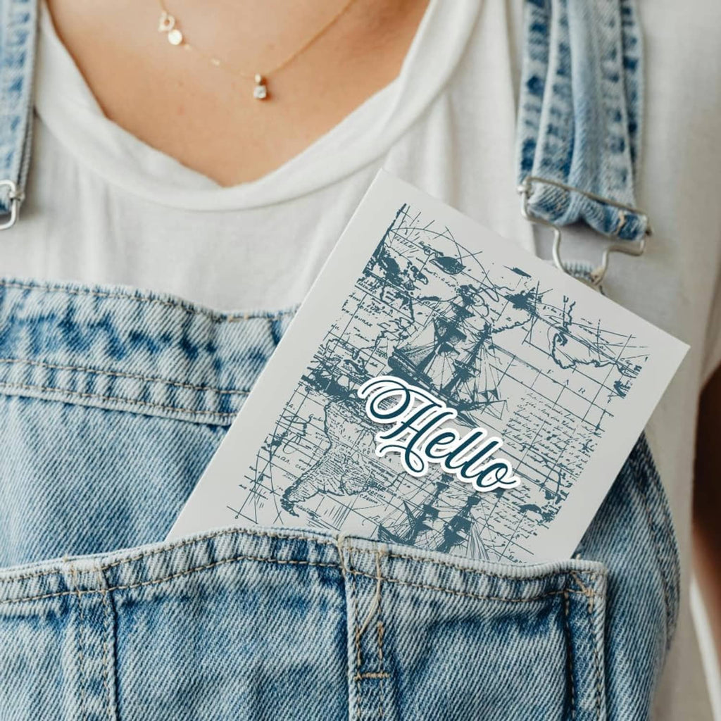 Blue-ink sailboat stamp design on white paper with “Hello” script