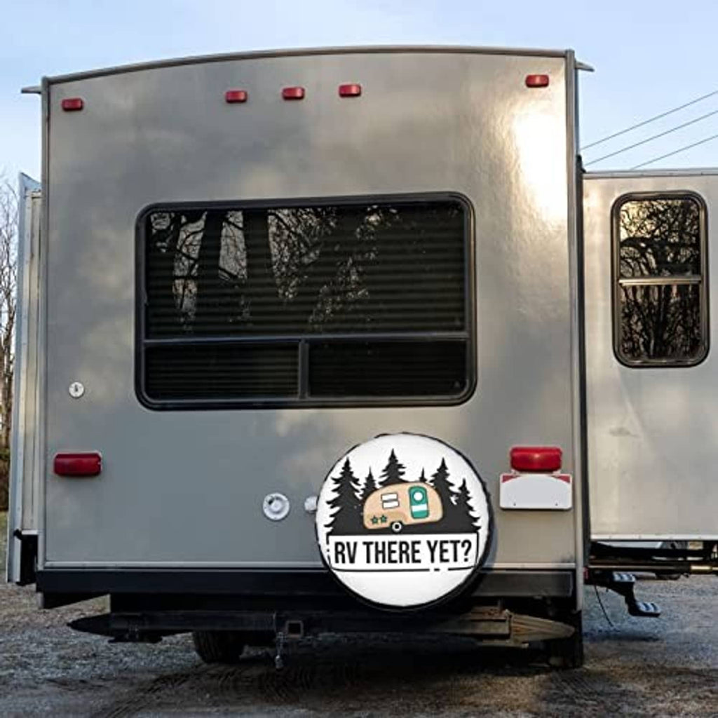 Rear of a trailer RV with a white circular spare tire cover, camper and tree graphic
