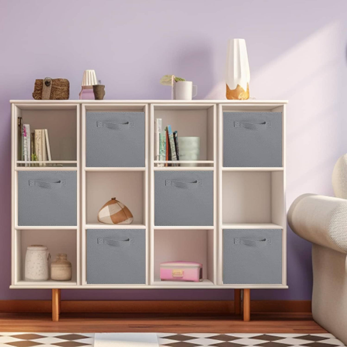 Gray fabric storage cubes with side handles, organized inside a cabinet