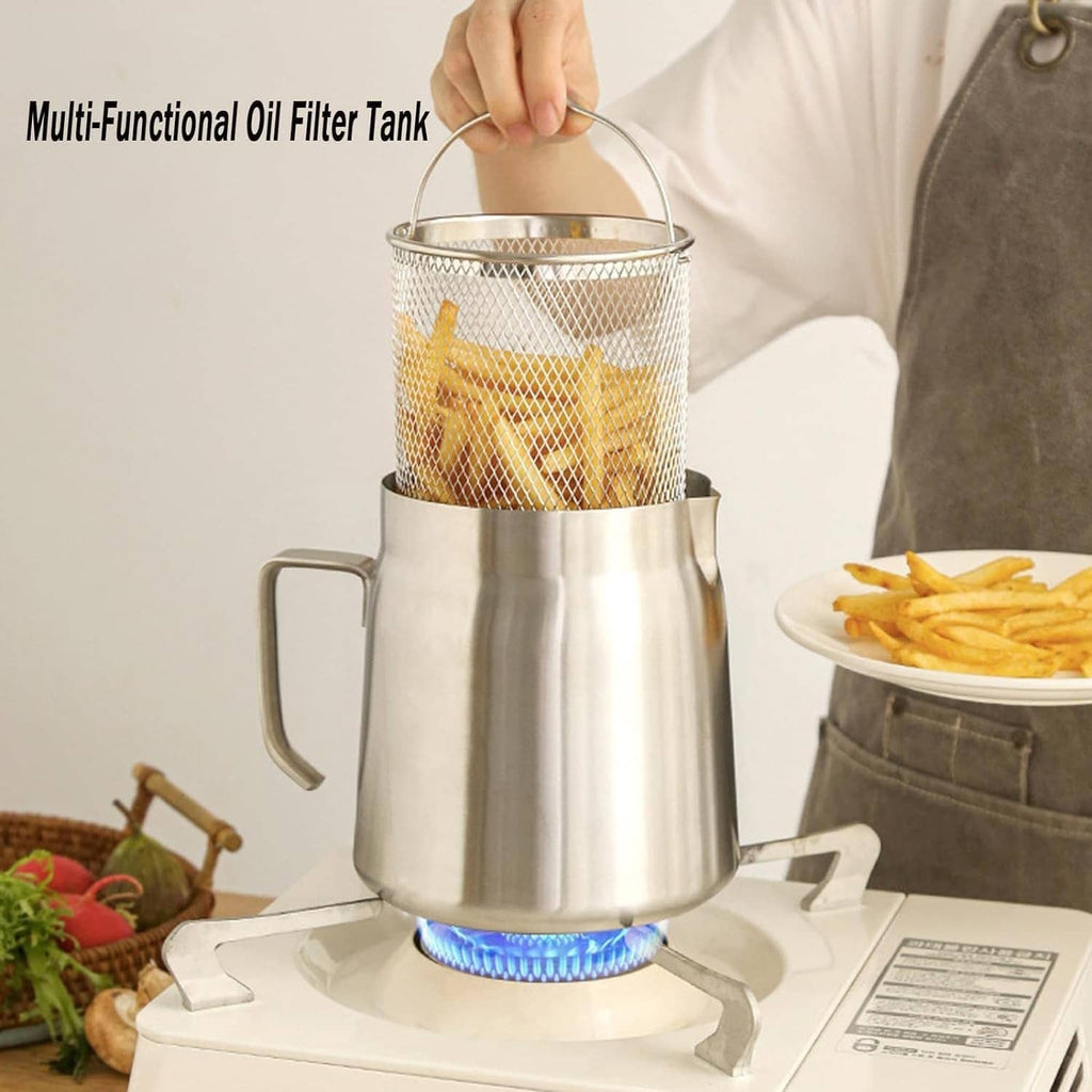Stainless deep fryer pot on a stove with wire basket of fries being lifted