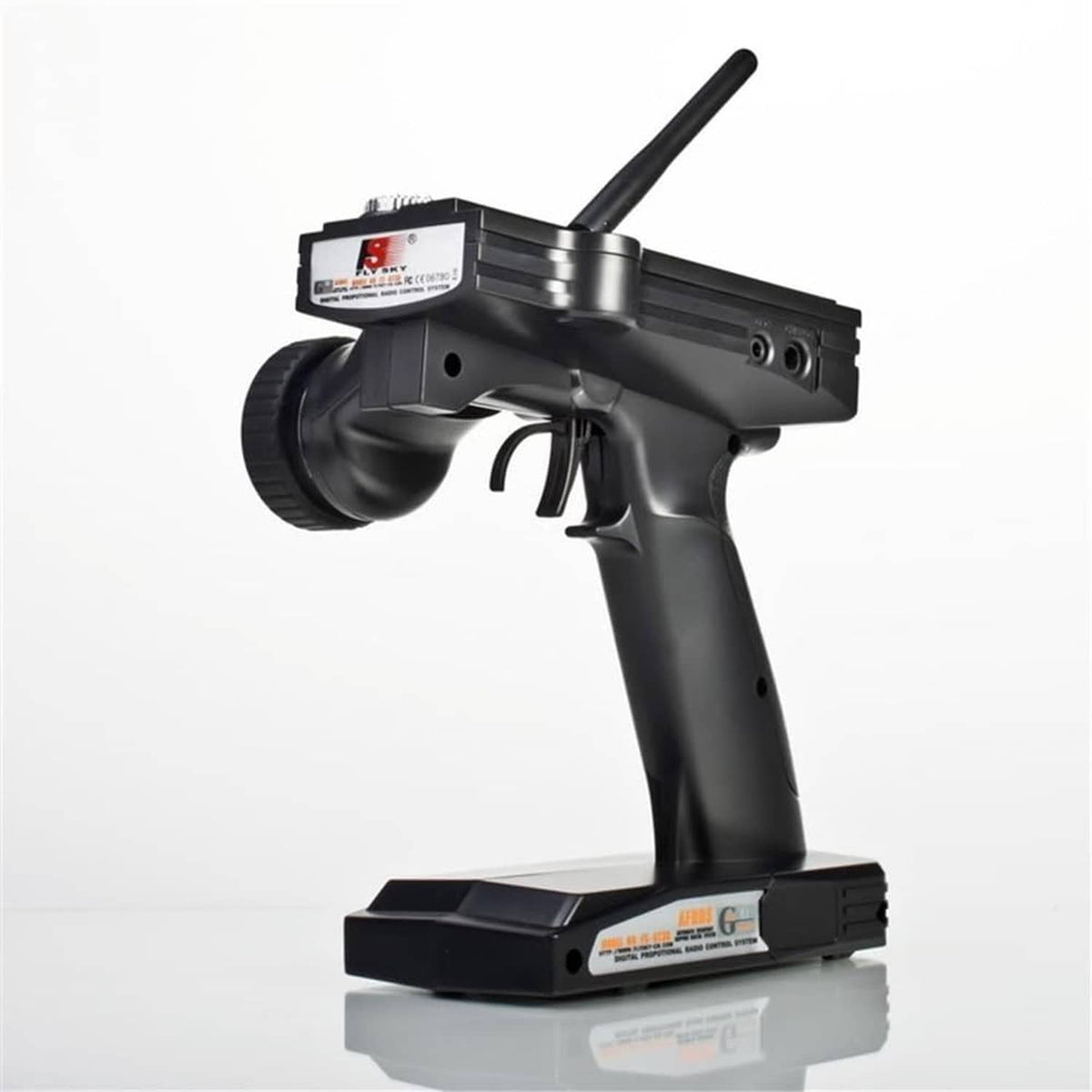 Black RC car transmitter with antenna and control trigger, front-side view