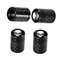 Black carbon fiber-style tire valve stem caps, threaded caps with skull logo on top