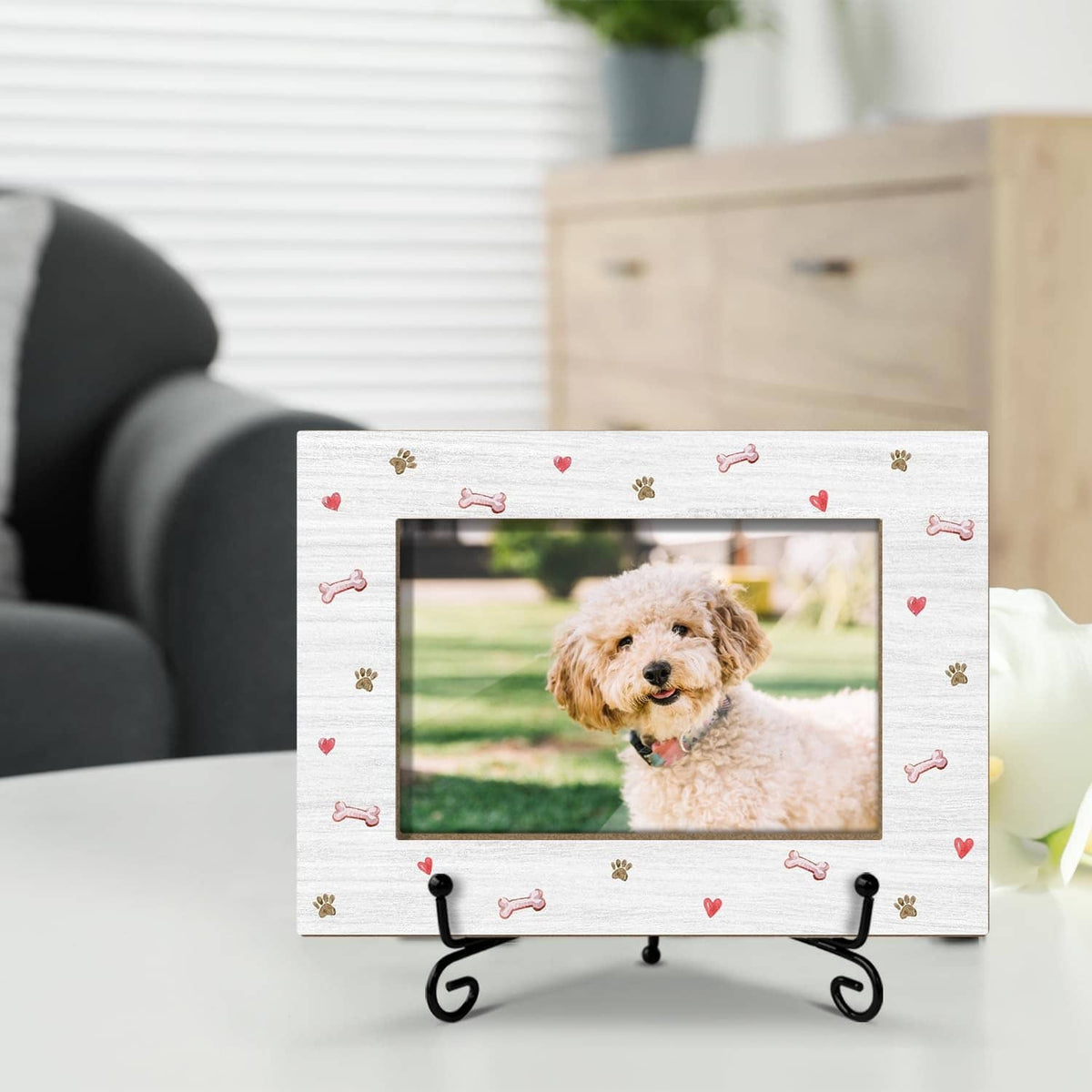 White dog photo frame with paw and bone accents on black tabletop stand.