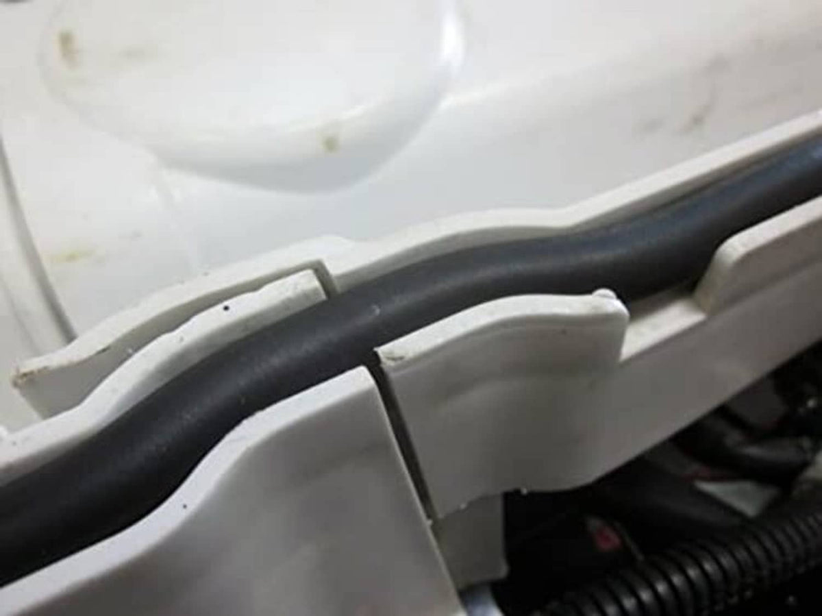 Close-up of black rubber seal gasket between front rack storage panels