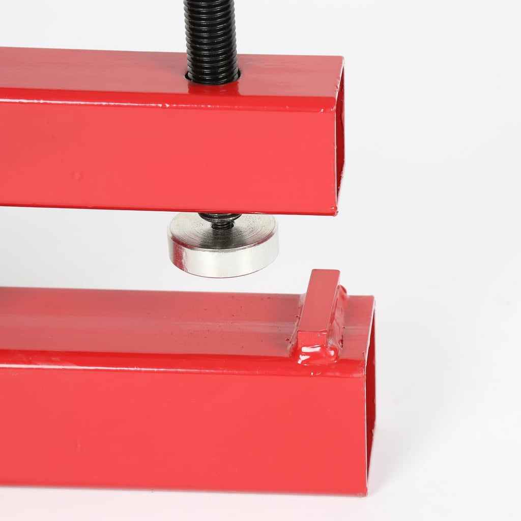 Red ball mount receiver clamp detail with threaded rod and silver washer, close-up