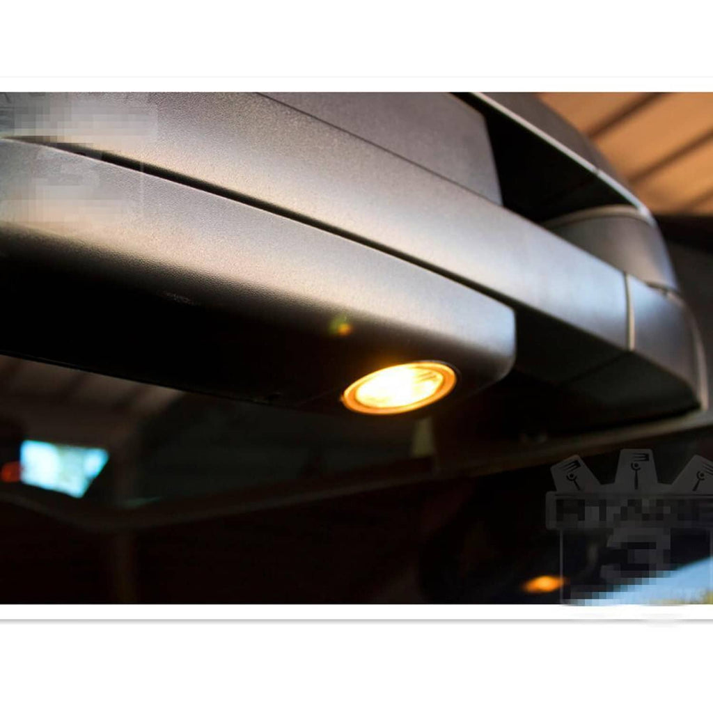Warm puddle light on black tow mirror housing