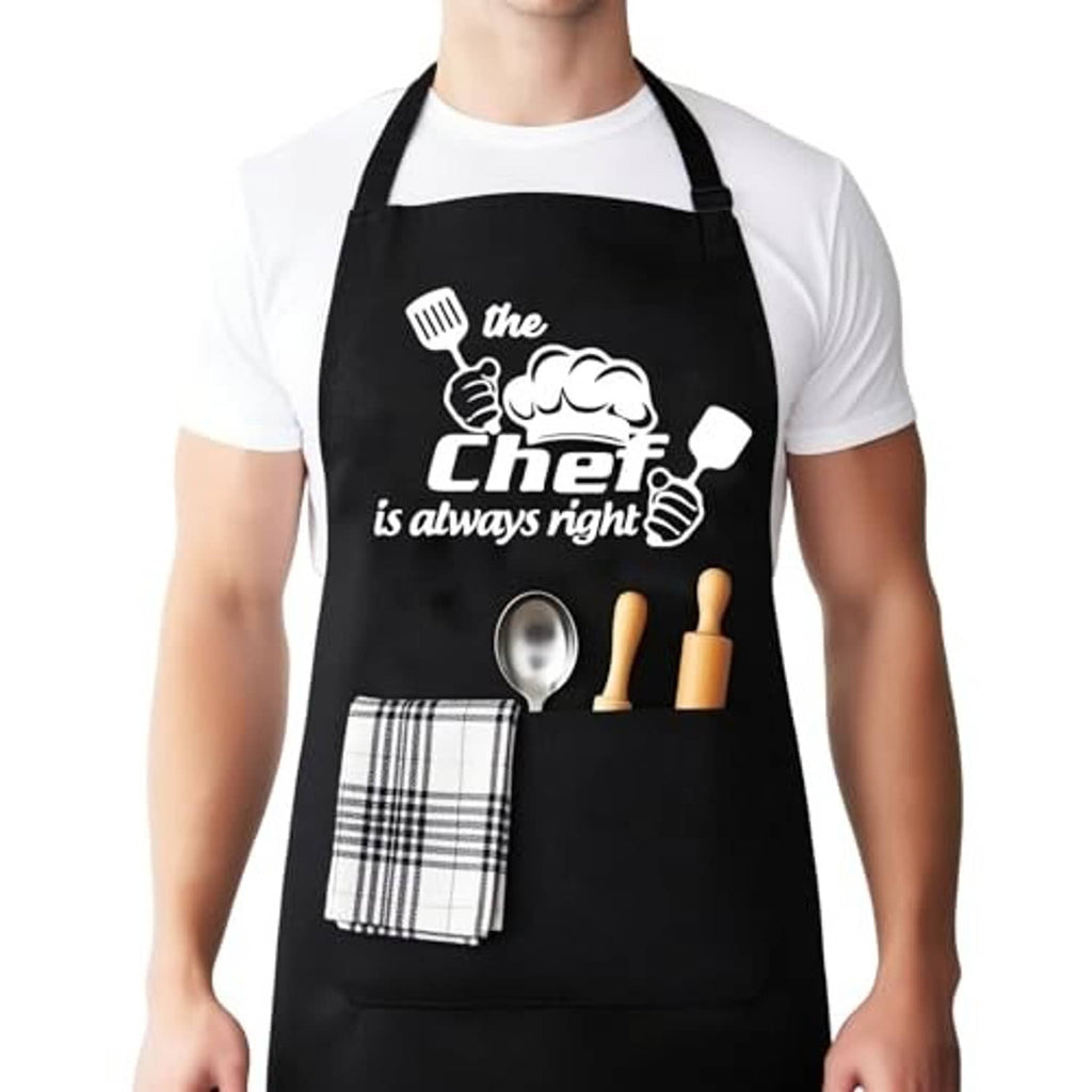 Black chef apron with slogan print, front pocket, spoon graphic, and plaid towel accent