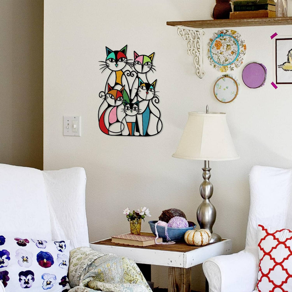 Metal cat wall art with five retro cats in a colorful cutout design on a wall