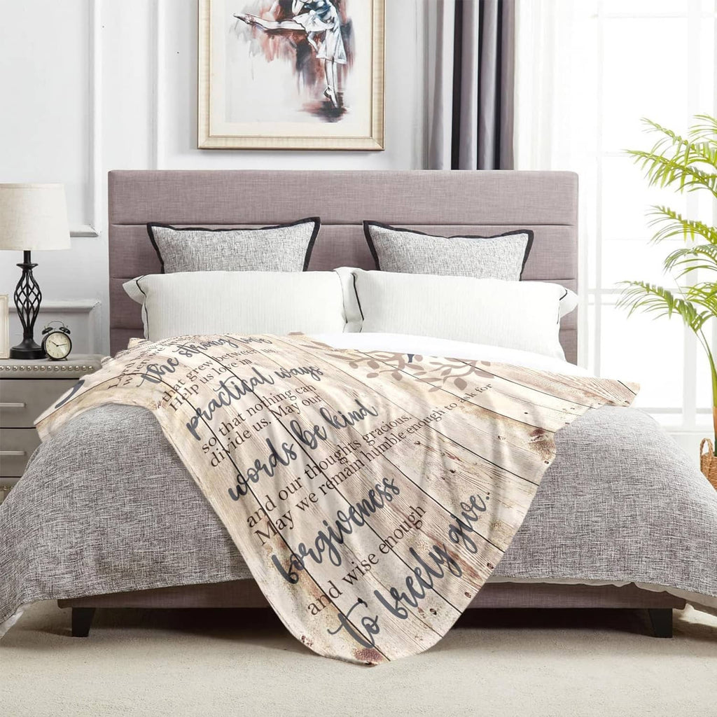 Beige marriage prayer throw blanket with printed prayer text and leaf graphics