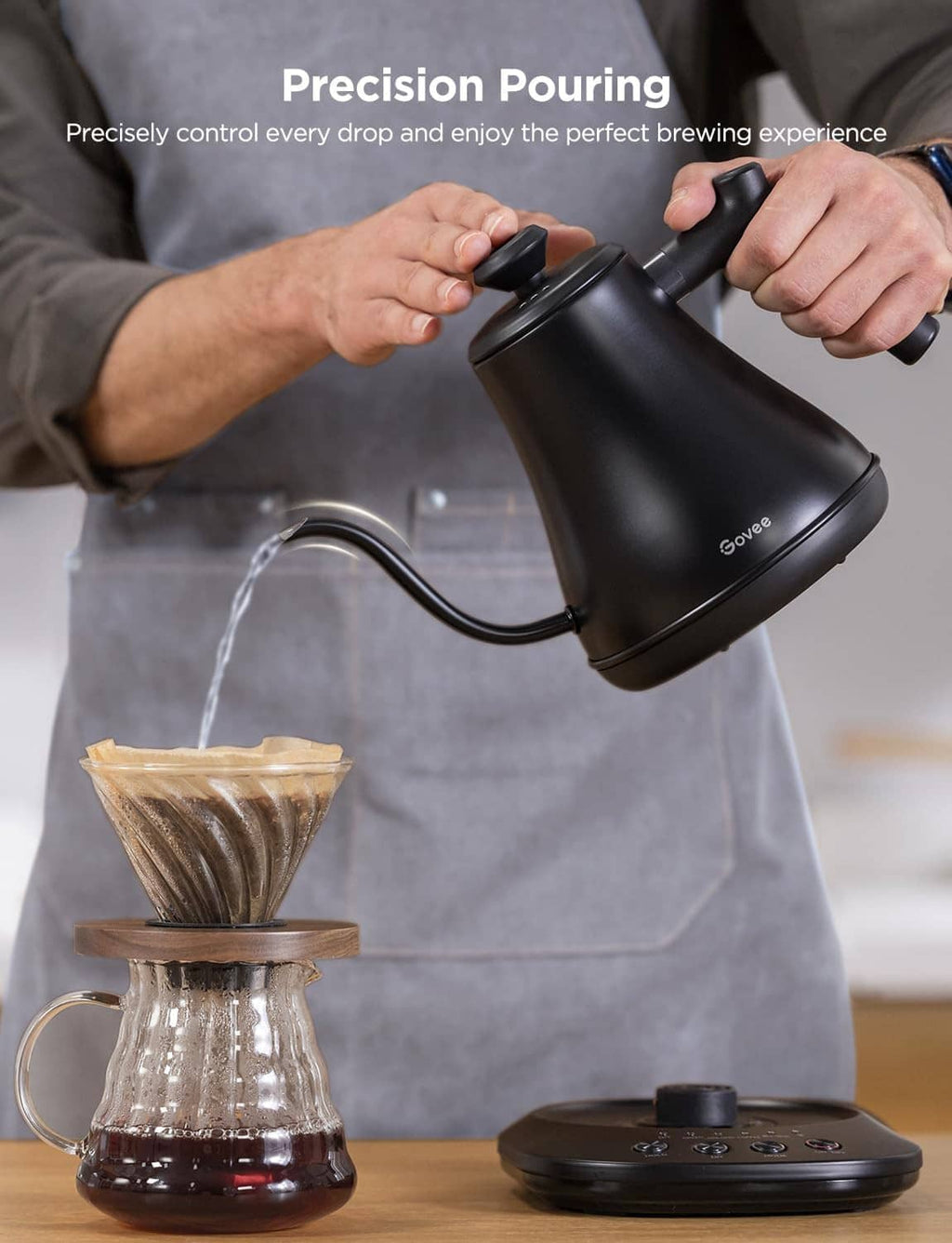 Black gooseneck electric kettle being poured into a coffee dripper setup