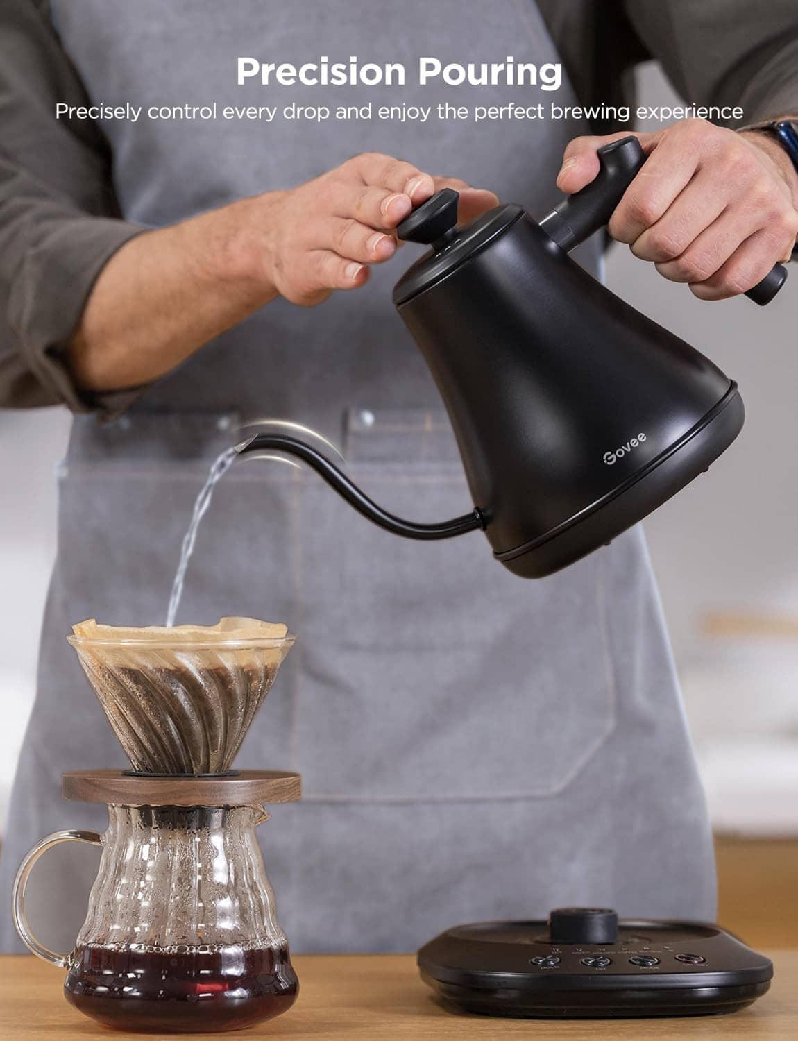 Black gooseneck electric kettle being poured into a coffee dripper setup