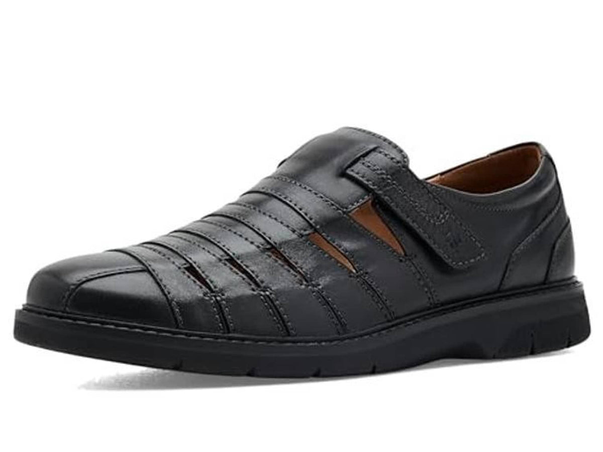 Black leather casual shoe with side strap, cushioned upper, and stitched lines