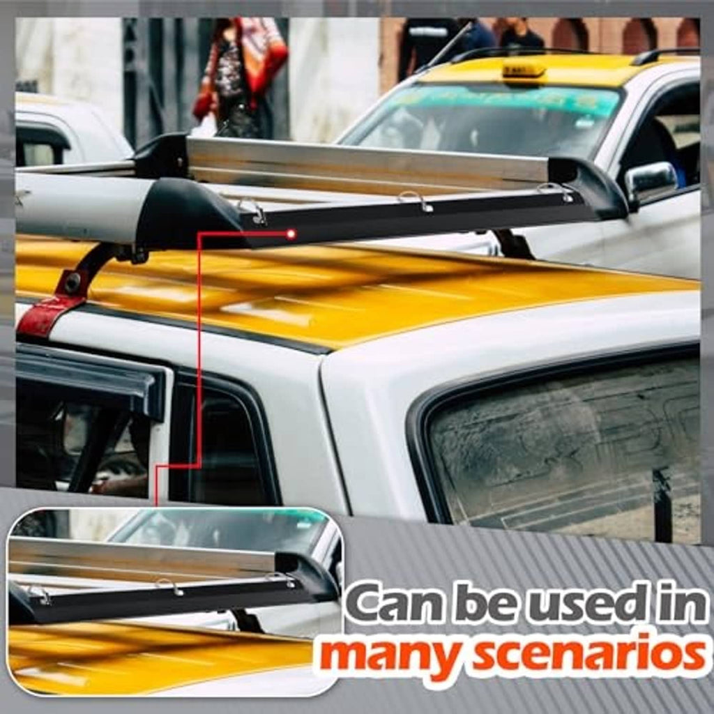 Black roof rack wind deflector mounted along vehicle hood
