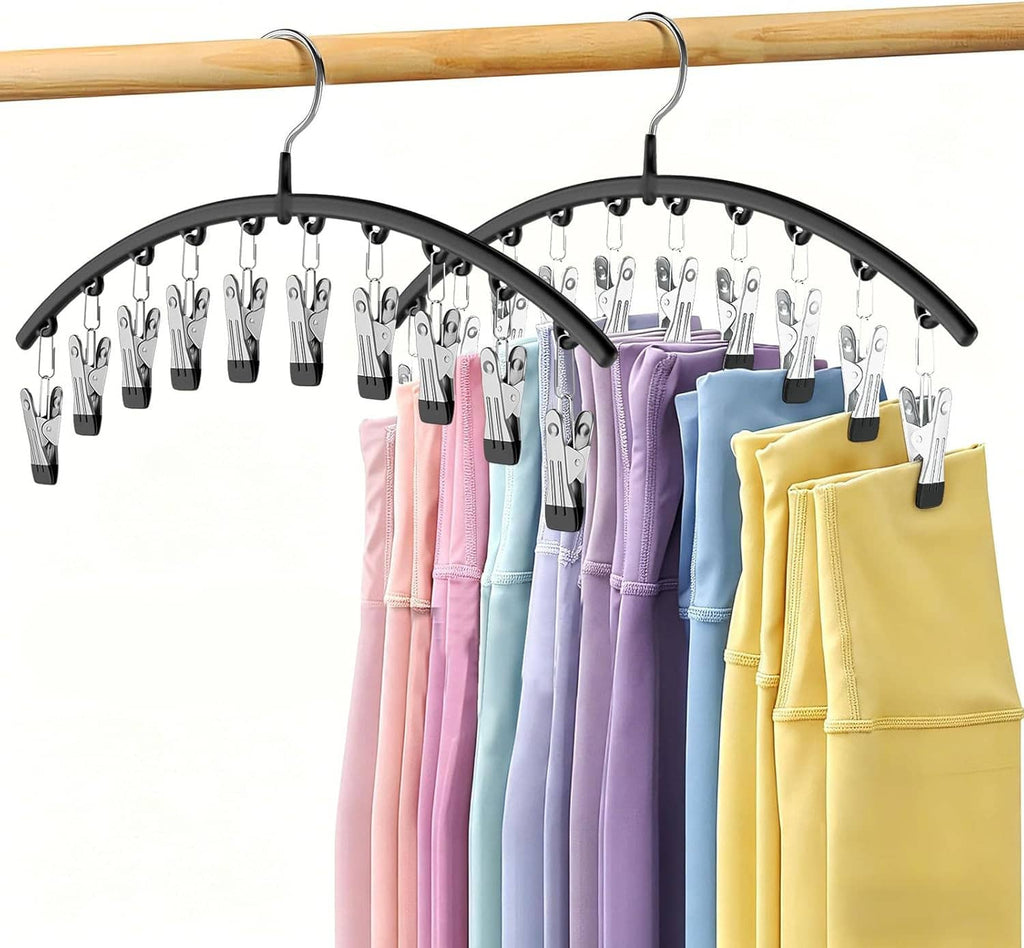 Metal arched legging organizer with clips holding folded colorful pants
