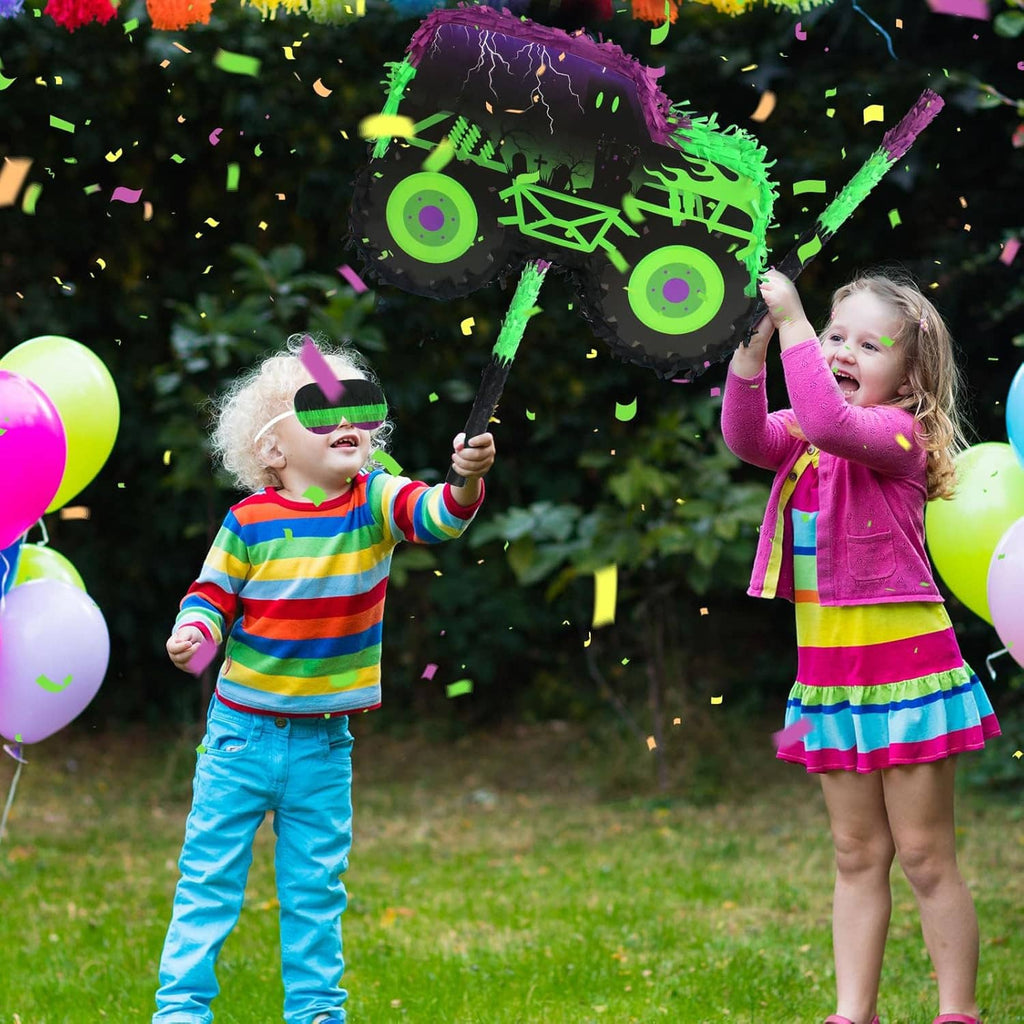 Green and purple monster truck pinata with stick and blindfold