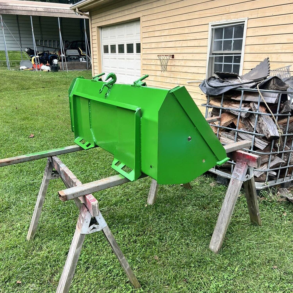 Green skid steer mount adapter plate on a work stand, showing mounting arms