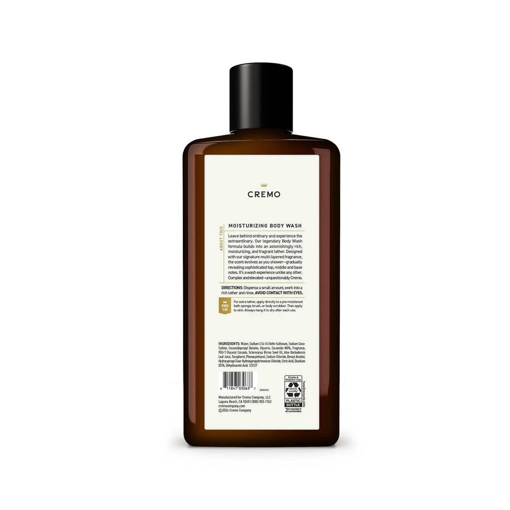 Cremo body wash bottle back view with ingredient label, amber bottle, black cap