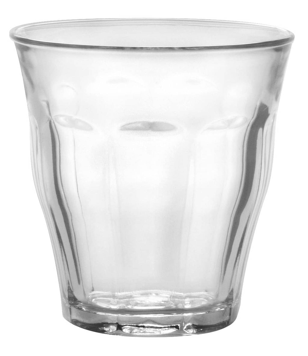 Clear glass tumbler with thick base and rounded rim