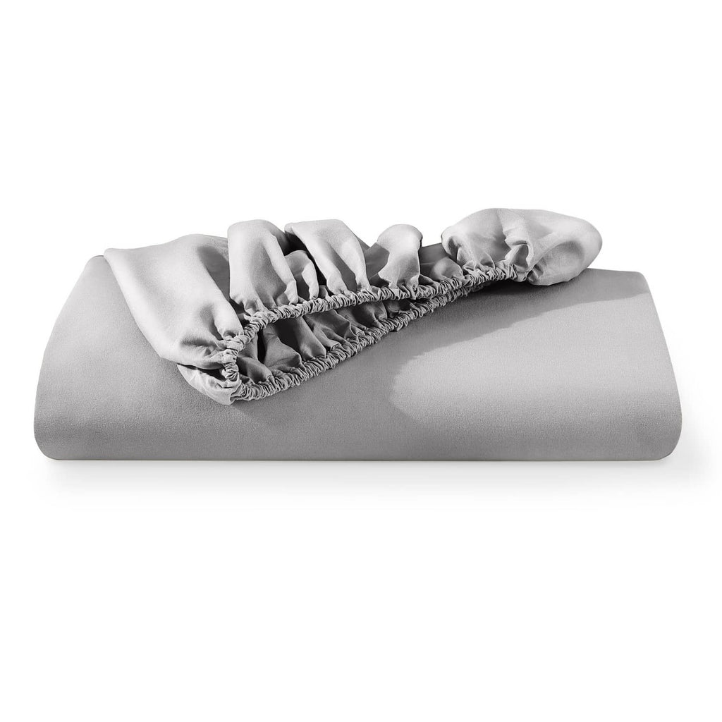 Light grey fitted sheet folded with gathered elastic edge