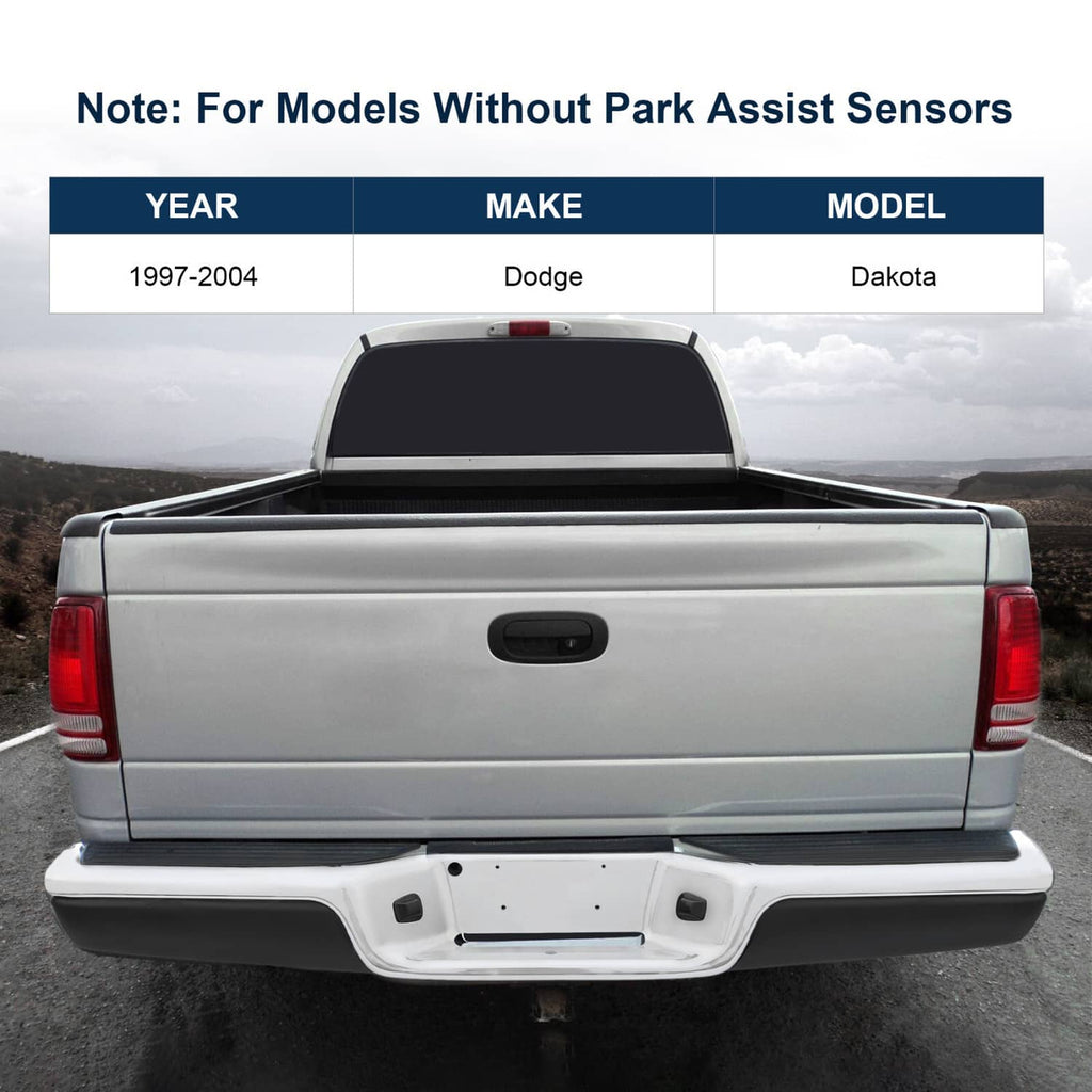 Installed rear step bumper assembly with chrome steel bar and black step pads on pickup.