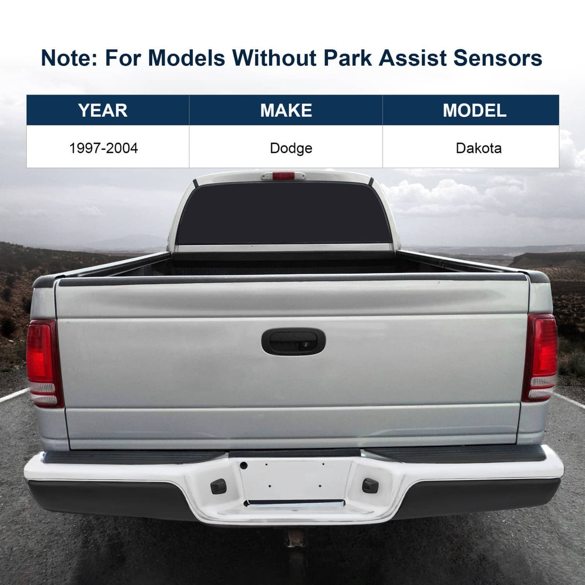 Installed rear step bumper assembly with chrome steel bar and black step pads on pickup.