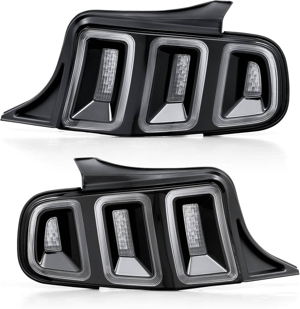Pair of black taillight assemblies with clear lenses and vertical LED light strips