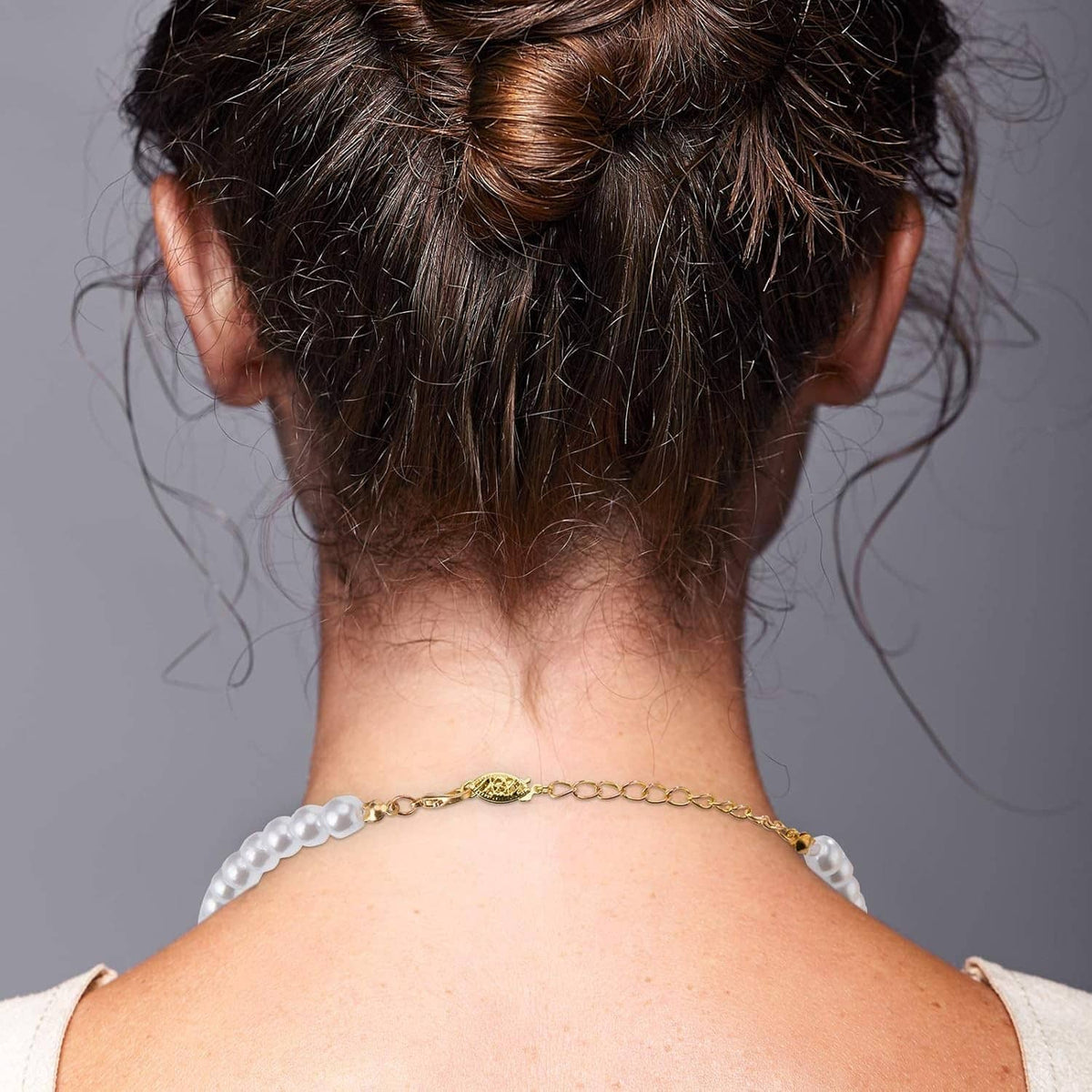 Pearl-look beaded necklace with gold oval filigree clasp and small fish hook closure