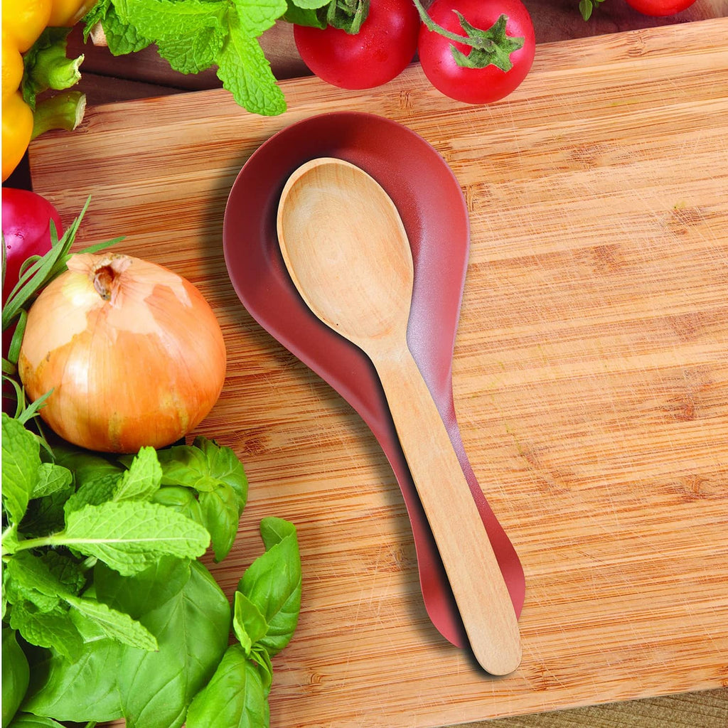 Brick-red stainless steel spoon rest with a wood spoon on top