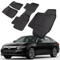 Set of black rubber car floor mats with raised grooves and custom fit sections