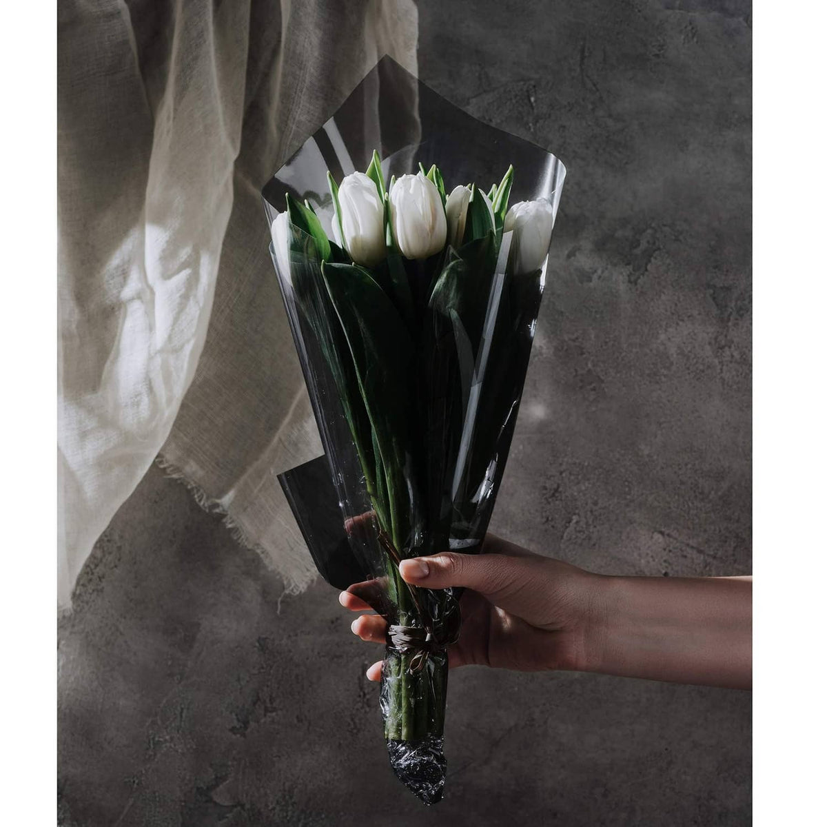 Dark translucent cellophane sheet bouquet wrap with crinkled top fold