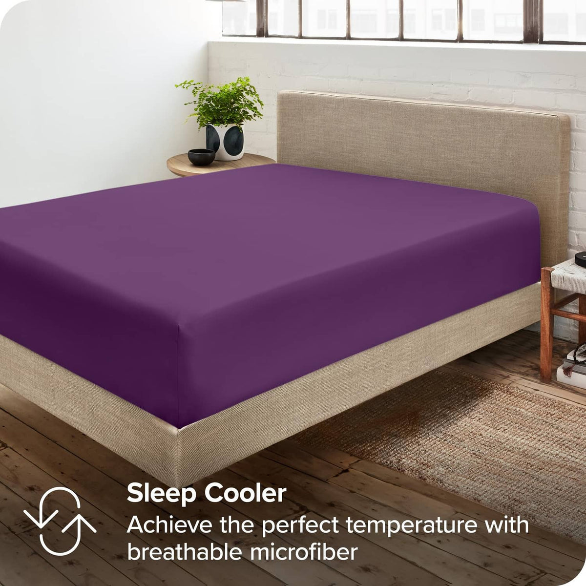 Purple fitted sheet on bed with smooth top and stretch-corner fit