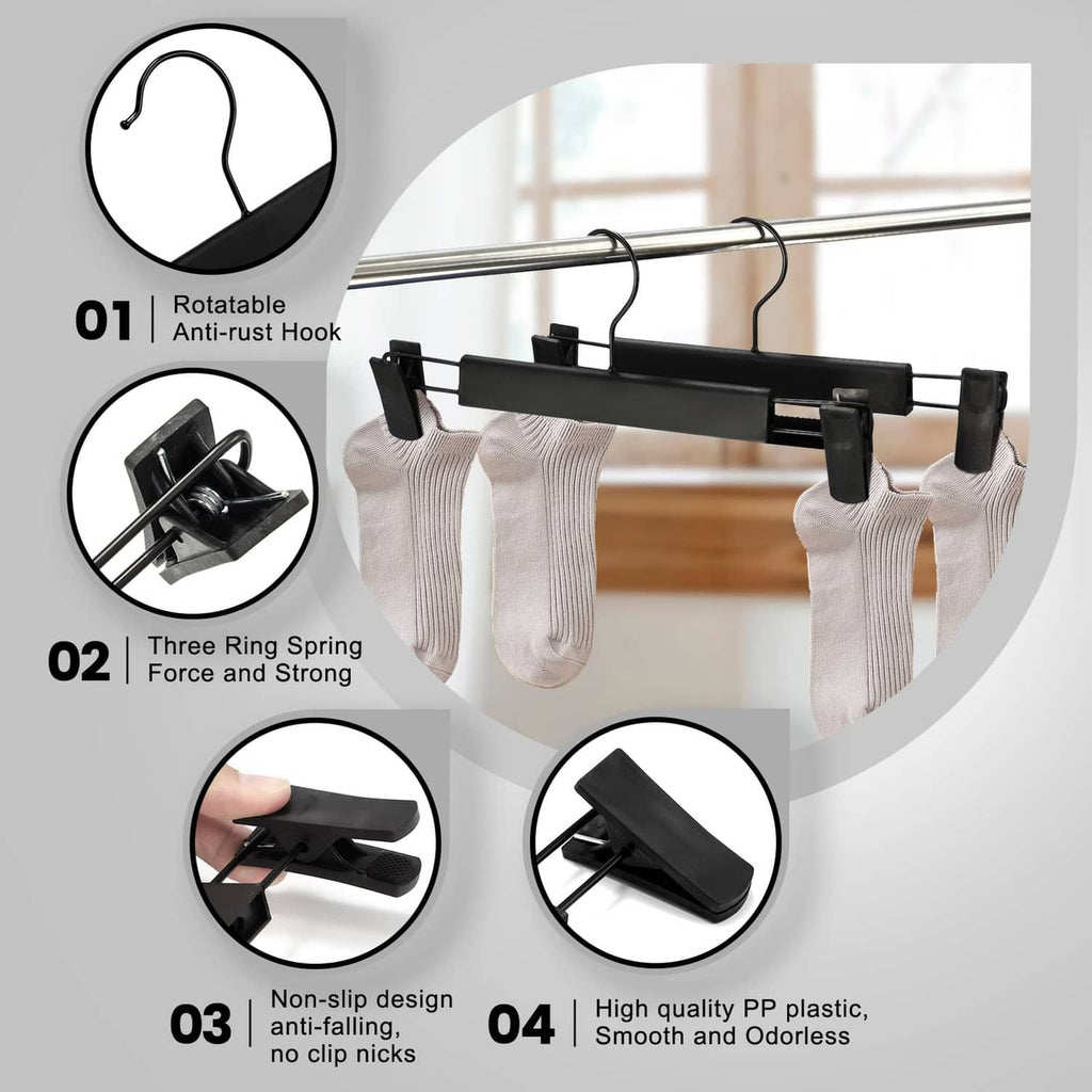 Black pants hanger with rotatable hook and spring clips with non-slip gripping pads