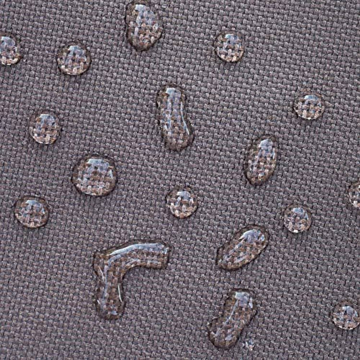 Texture close-up of brown waterproof fabric with small patterned dots