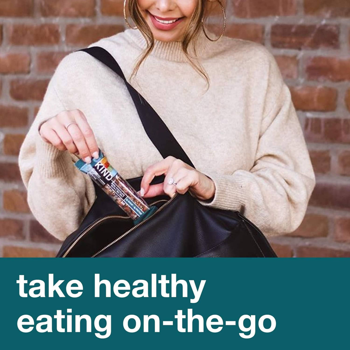 Person holding a Kind snack bar package and bar for on-the-go eating