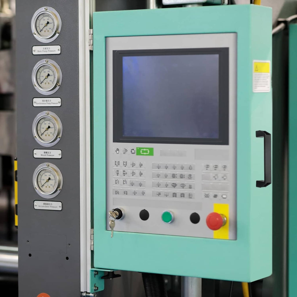 Black plastic pull handle on machine control panel, rectangular side grip