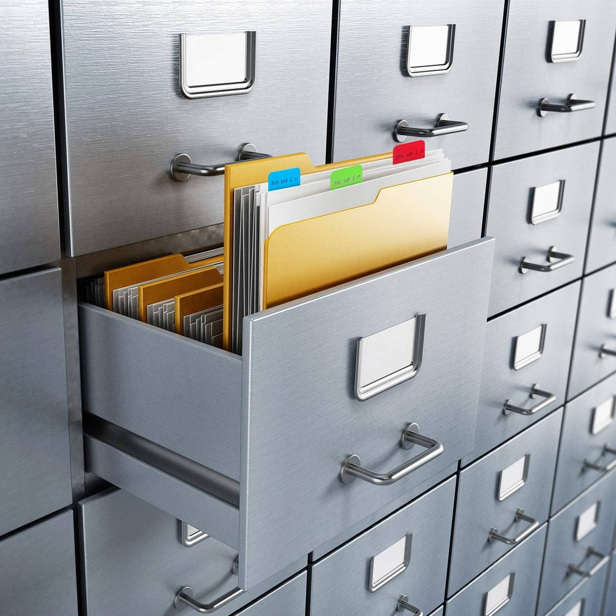 Sticky index tabs on file folders inside a drawer organizer