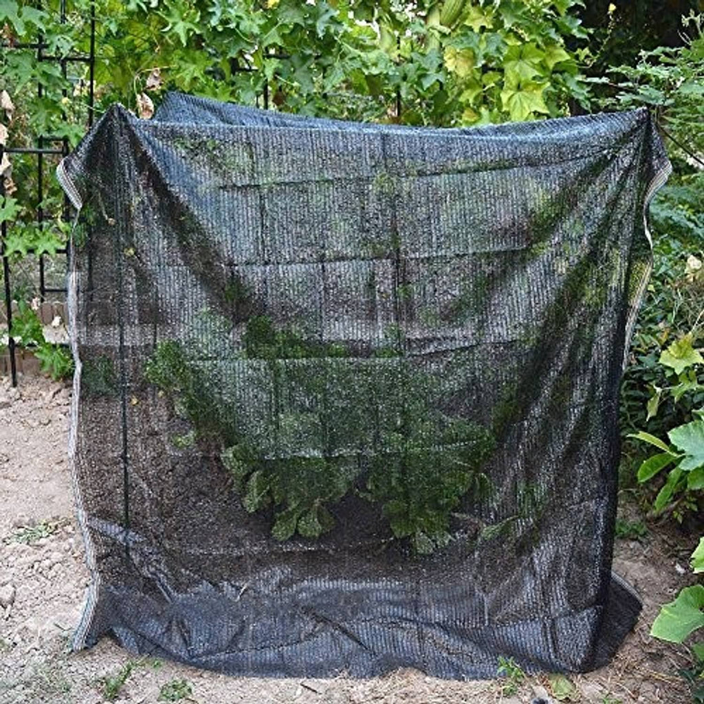 Black sun-shade mesh net cover, draped and pleated for outdoor use