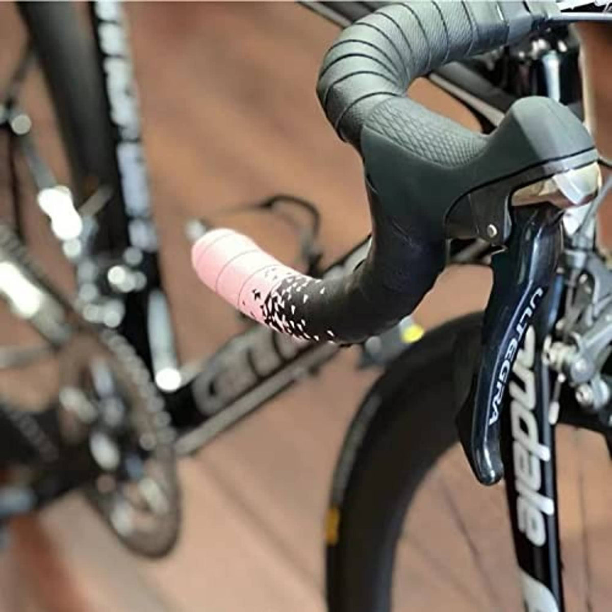 Black bike brake lever grip hoods installed on handlebar levers