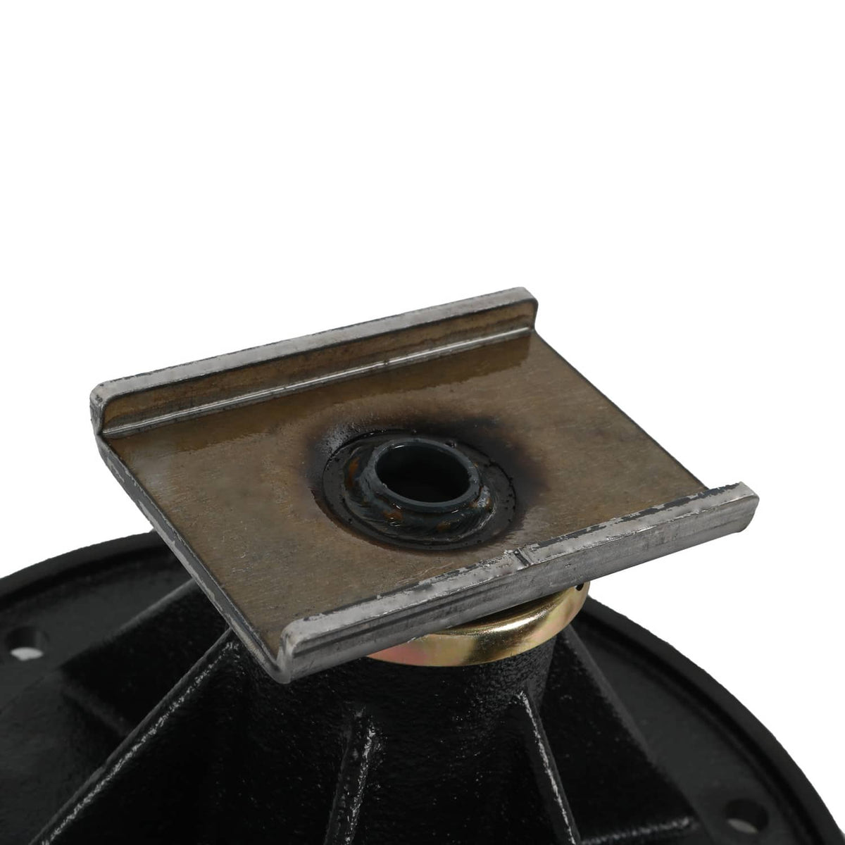 Close-up of deck spindle top plate with center bearing opening on black base